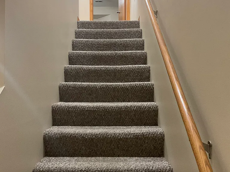 Stairwell to two Master Suites and Laundry Room