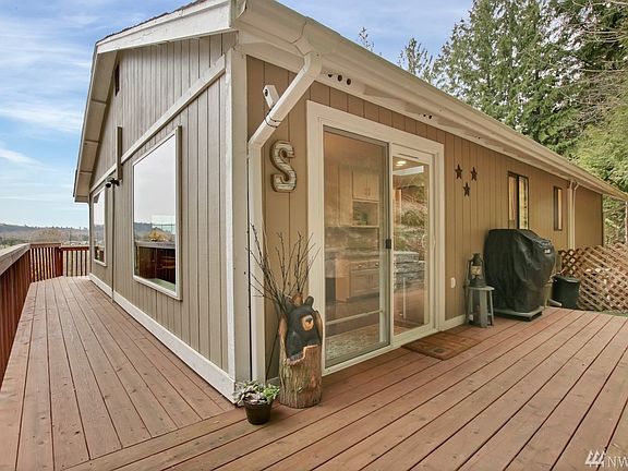 Expansive deck enjoys rear entry to home.