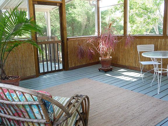 Large covered entry porch, where the ocean breeze ever is. Newly painted.