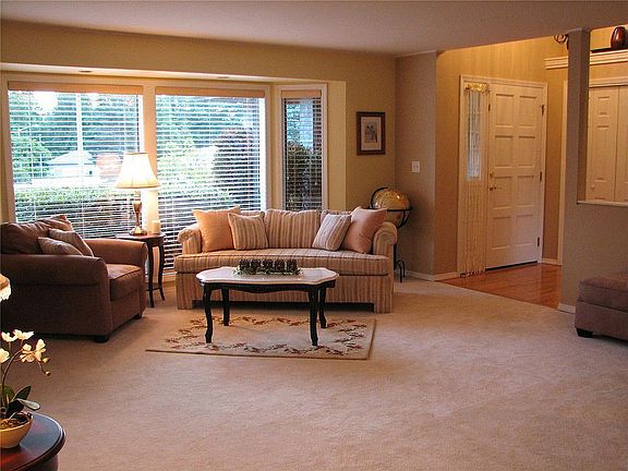 Bay windows add additional space to the large living room.