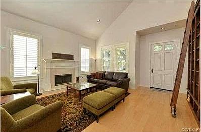 Living room with built-in bookshelves and Library ladder
