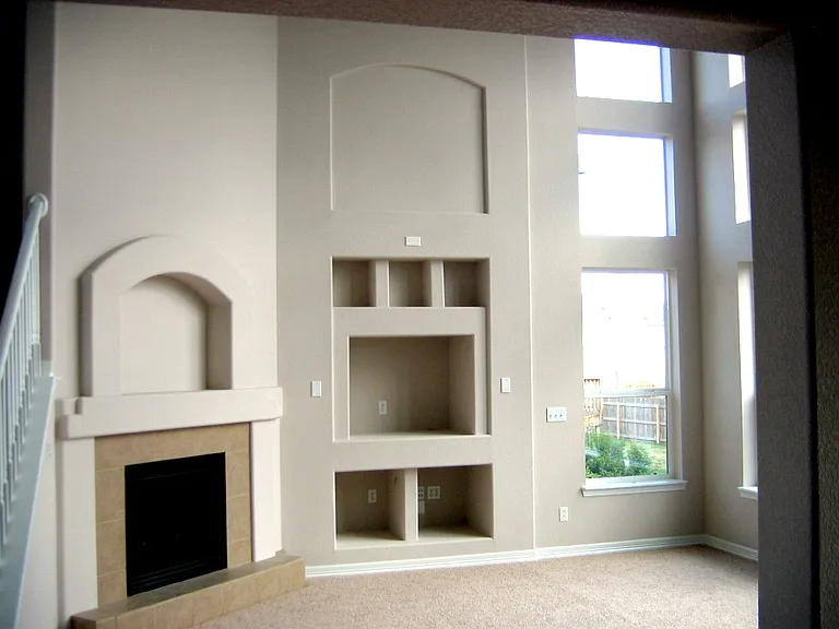 Living room with a large entertainment center.