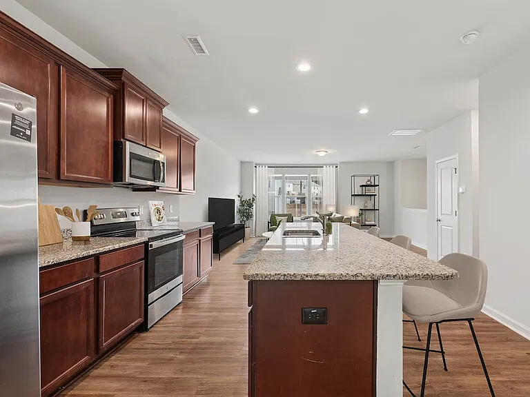 Classic Package Chef-inspired kitchen with stainless steel appliances and granite countertops