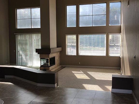 Formal Living and Dining Room with 3 Sided Fireplace