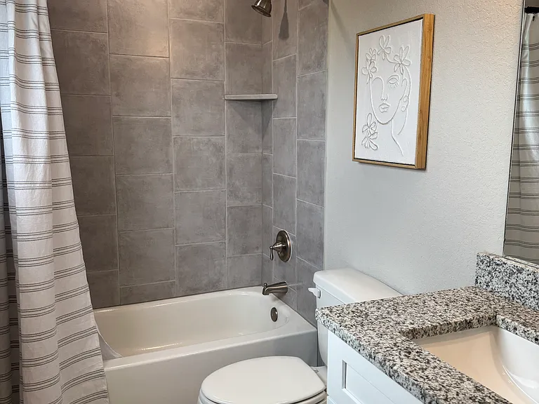 Bath 2 features a bath/shower combo