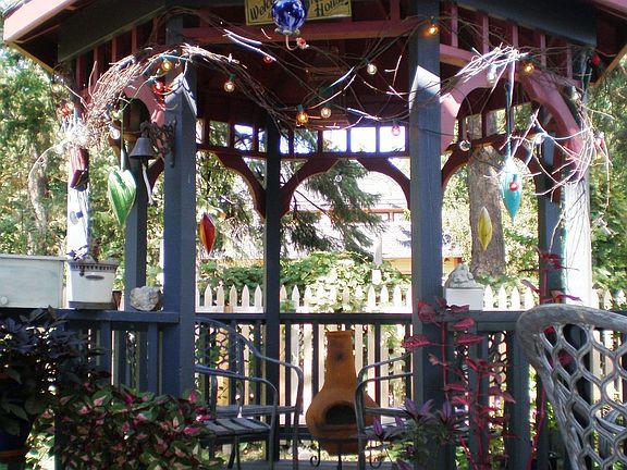 Inviting Gazebo overlooks fenced backyard.