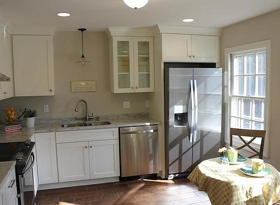New recessed lighting, large extra deep, double bowl undermount sink. Photo does not show second window in this bright and airy kitchen