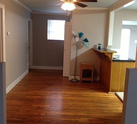 This Versatile space, (9.6' x 12') is petitioned from living room and open to kitchen. Could be made formal dining, or keeping room for visiting while cooking and entertaining. Notice breakfast bar in right side of pic as space opens into kitchen.