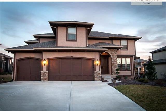 North Facing, popular Hepburn II plan with lovely stone wall entry!