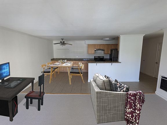 Pictured again with virtual staging in living room and dining area.