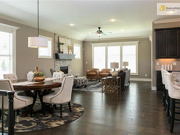 Wide open floor plan perfect for entertaining family and friends. Upgraded wood flooring and designer lighting throughout. Programmable thermostat for enhanced energy efficiency and energy-efficient hot water heater.