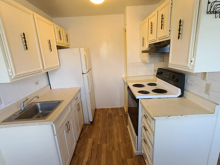 Refrigerator-freezer, electric range oven.