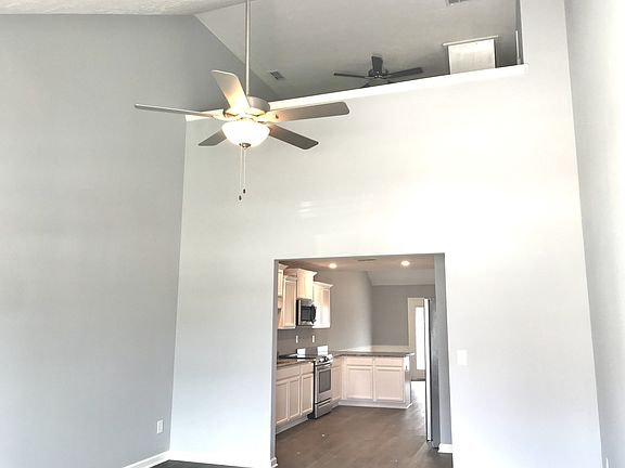 Stock photo of this awesome entrance Soaring ceiling in great room with upstairs loft overlook. Yo