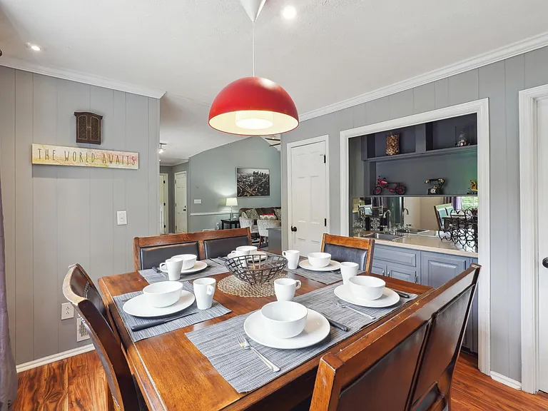 Eat-In Kitchen Area with Bar Area and staircase up to Master Bedroom -Main Level