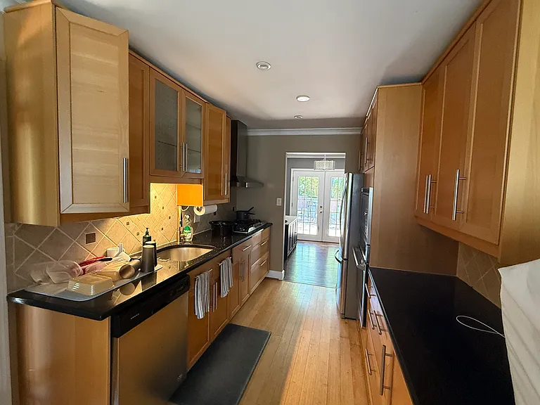 Full updated kitchen - left includes dish washer, sink, gas range - right includes refrigerator, microwave, oven and countertop
