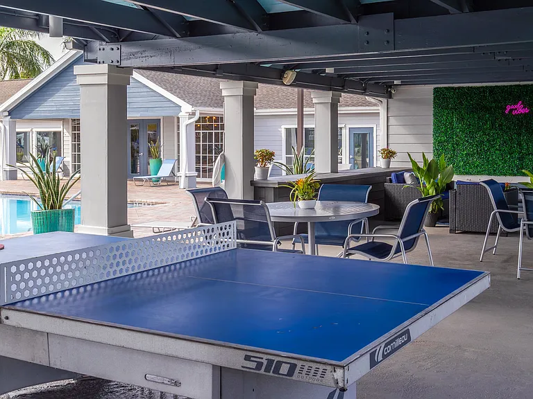 Enjoy the perfect mix of leisure and fun with poolside ping pong, shaded seating, and lush tropical surroundings.