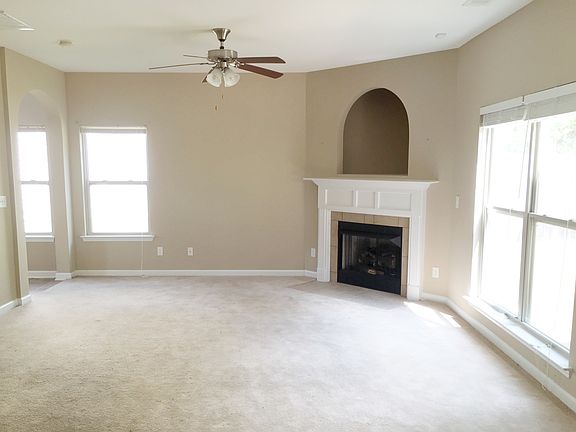 Very open and airy den with cozy fireplace