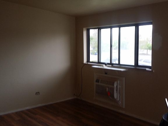 large livingroom area with wood floors and built-in A/C