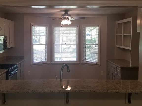 New granite bar between kitchen and living room.