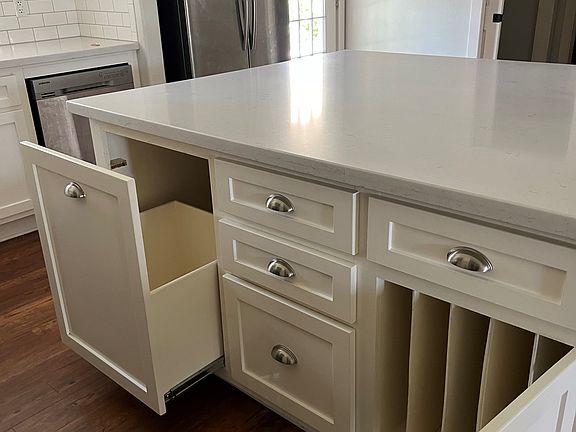 Awesome storage in kitchen, pull out for trash, and dividers for trays, cookie sheets, etc.