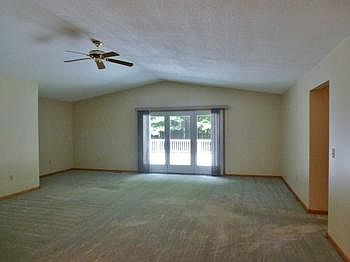 Living room has a patio door that leads out to the spacious back deck.