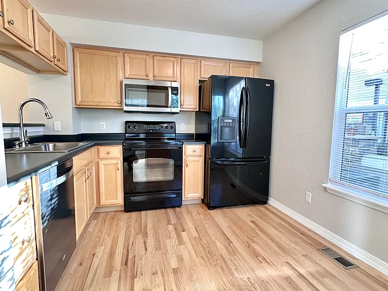 Kitchen with all appliances. Microwave and dishwasher were replaced Dec 2023.