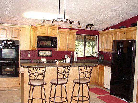Newly remodeled kitchen with lots of cabinets and large pantry. Newer applianc