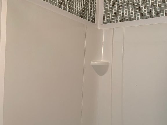 First Floor Laundry Room with Shower, Toilet and Laundry Tub.