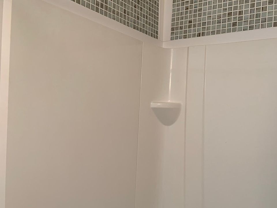 First Floor Laundry Room with Shower, Toilet and Laundry Tub.