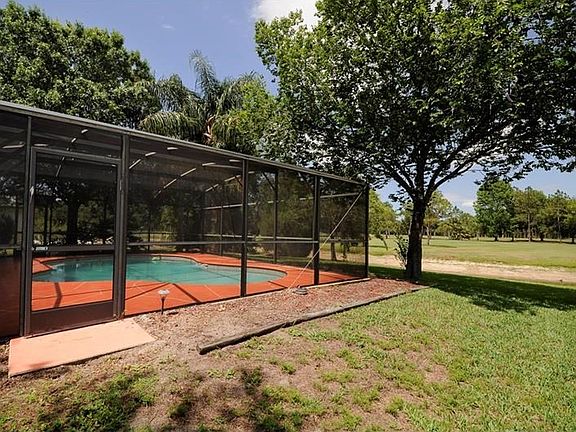 Side yard looking over pond (very low) and golf course