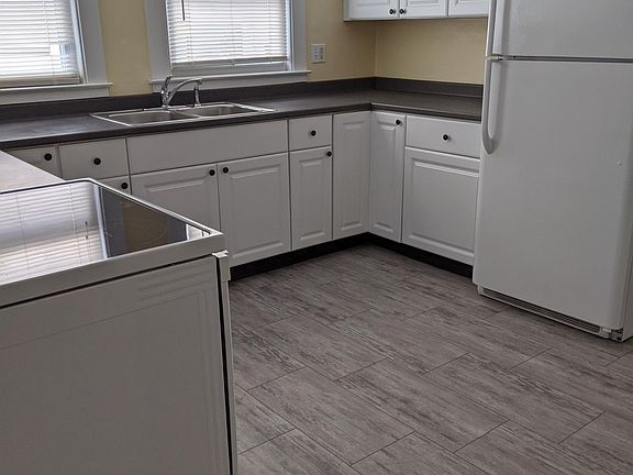 newer kitchen with new stove & new floor