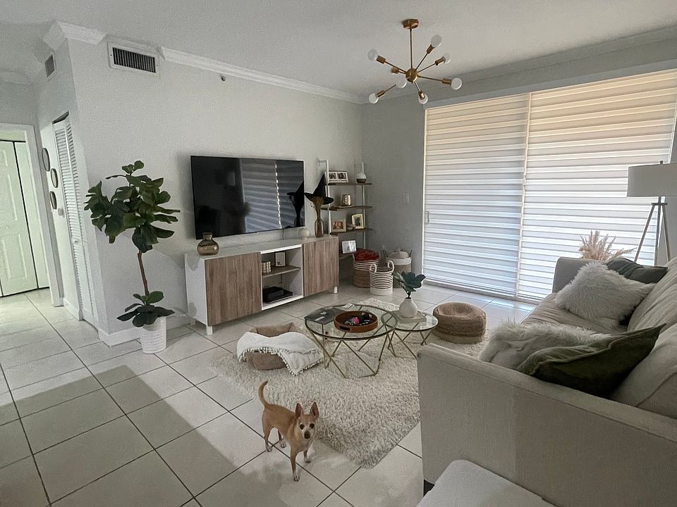 Living room area with sliding door access to terrace.