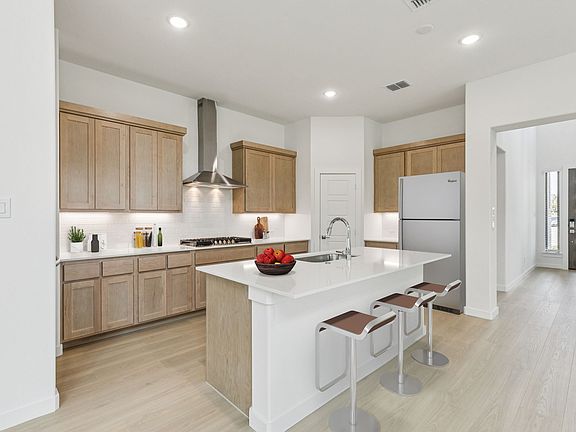 Kitchen in the Da Vinci II home plan by Trophy Signature Homes - REPRESENTATIVE PHOTO