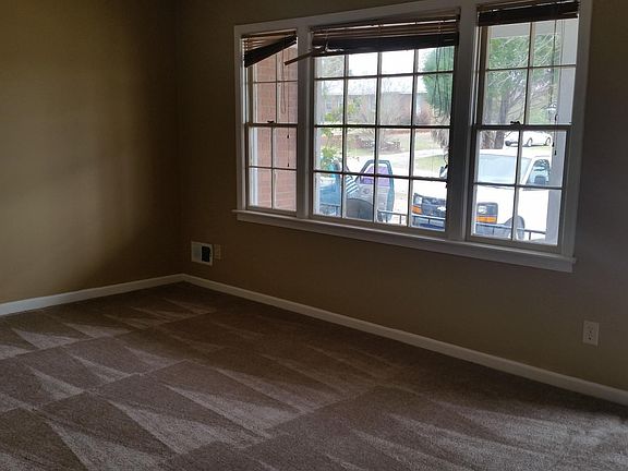new white vertical blinds have been installed in this room