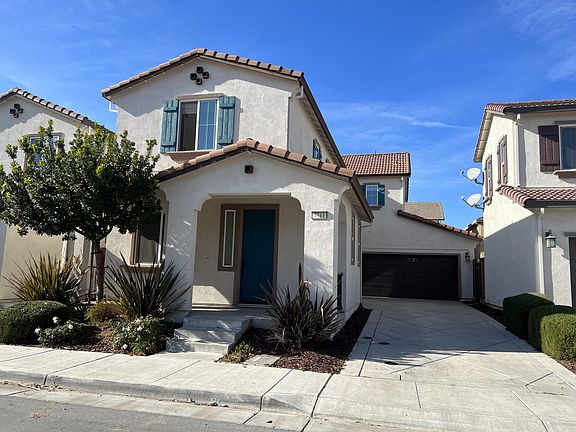 front of house with garage. 2 car off road parking