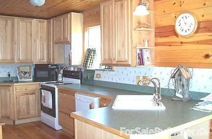Kitchen with Hickory Cabinets
						:
						Includes tall cabinets,pantry, lots of counter space, dishwasher