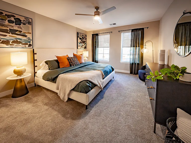 Spacious secondary bedroom with room for king-size furniture, oversized windows for abundant natural light, and privacy shades included in every apartment home.