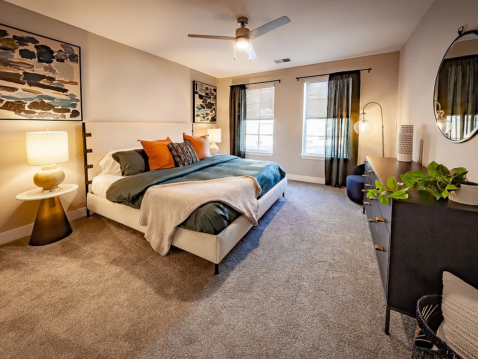 Spacious secondary bedroom with room for king-size furniture, oversized windows for abundant natural light, and privacy shades included in every apartment home.