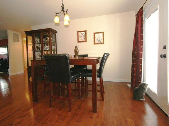 Dining area has French doors that open to deck and backyard view