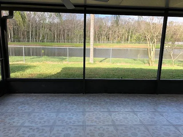 Screened porch overlooking to a pond