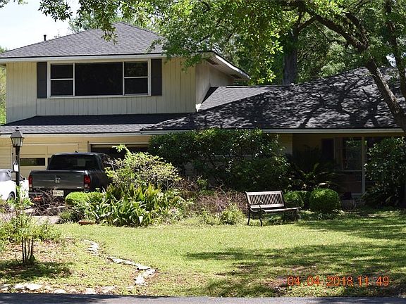 The home sits well back from the street. Tree shaded, it affords comfortable lounging and reading spaces, and has defined gardens, too. Though flooded for the first time in Harvey, Roof AC's, and major Underslab plumbing line have been replaced in recent 