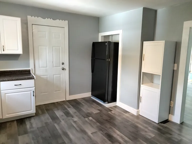 Kitchen showing side entrance door