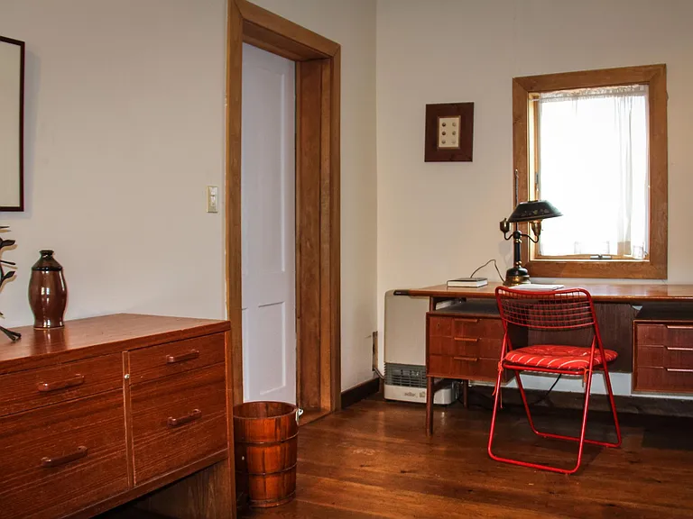Downstairs bedroom beside sunroom has efficient electric heater that can be turned off while main part of house is heated.
