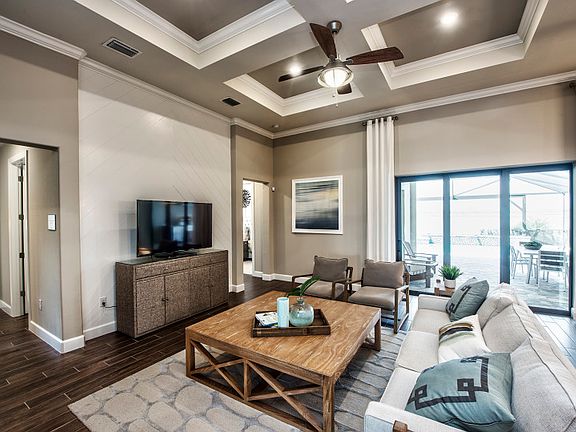 Model Representation Spacious gathering room with decorative coffered ceiling