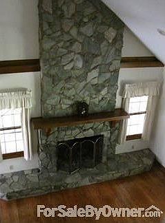stone fireplace has natural gas logs w/remote control