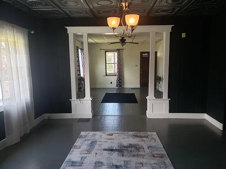 Dining and Living Rooms, 38" Long with Original Columns and Archway.