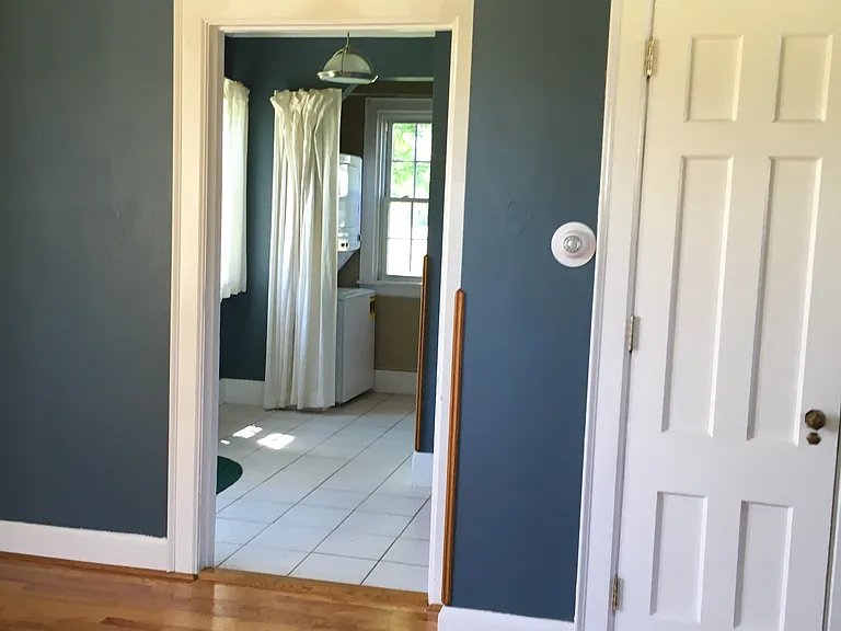 view from living room to front hall