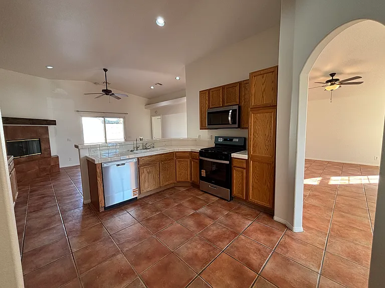 Spacious kitchen with abundant cabinetry, Whirlpool appliances, and an open connection to the main living areas.
