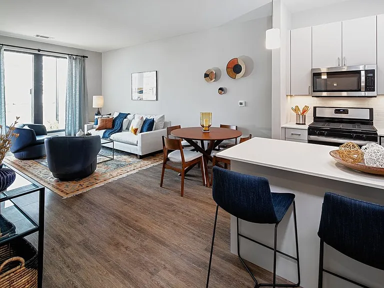 Base Scheme apartment home kitchen, dining, and living areas with hard surface flooring