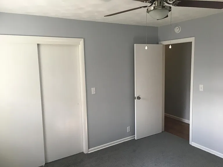 Slightly smaller second bedroom, also with nice sized closet and ceiling fan.